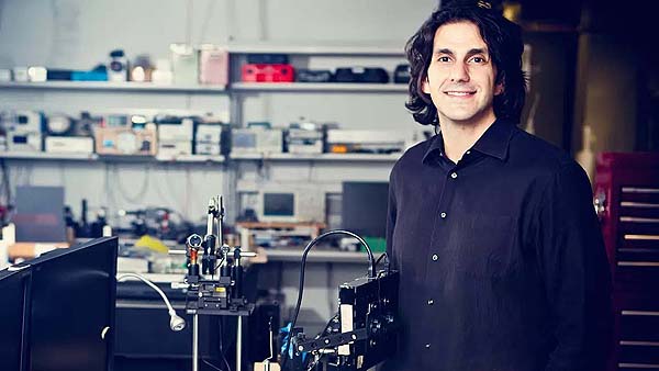 Steven Bathiche standing next to lab equipment