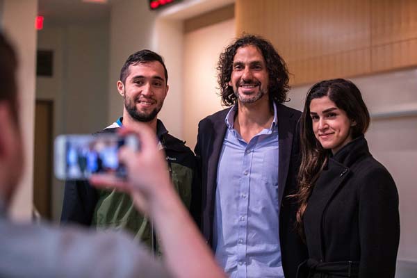 Steven Bathiche poses for photos with Virginia Tech students during his visit to campus