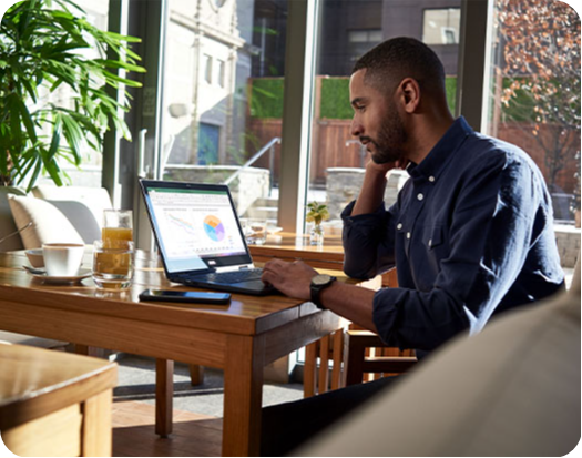 Man working on excel in his home office