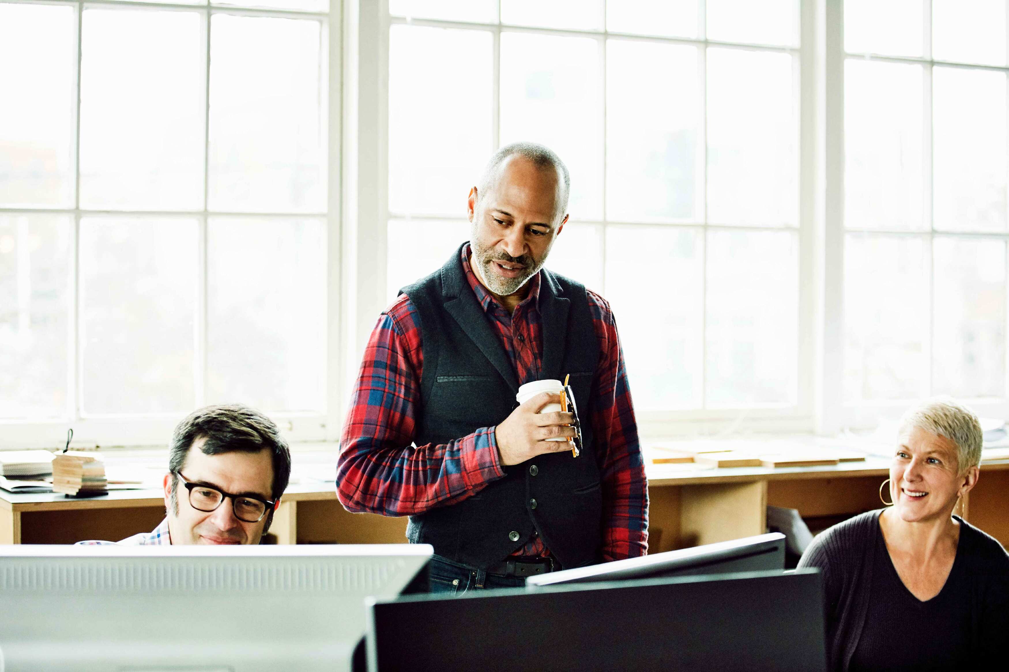 People working together on computers.